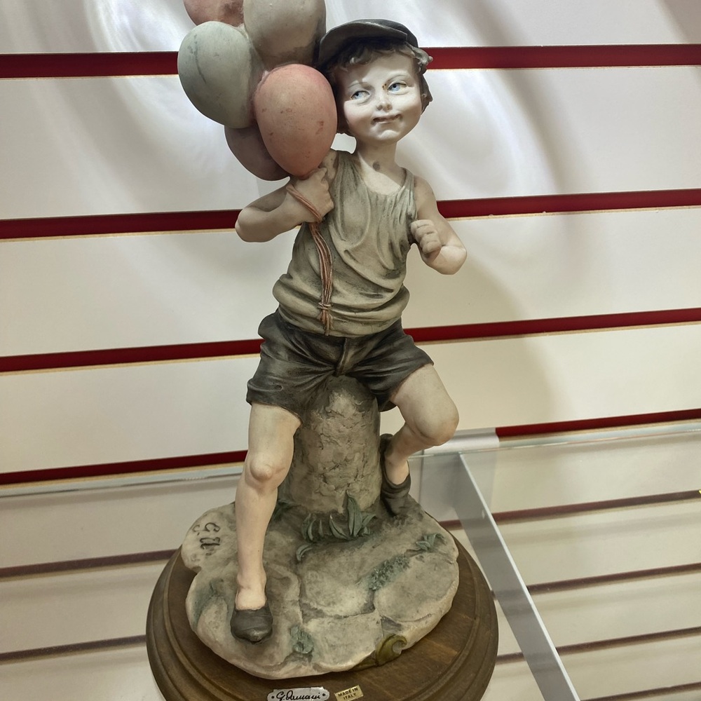 Playful Boy with Balloons Sculpture, By Giuseppe Armani